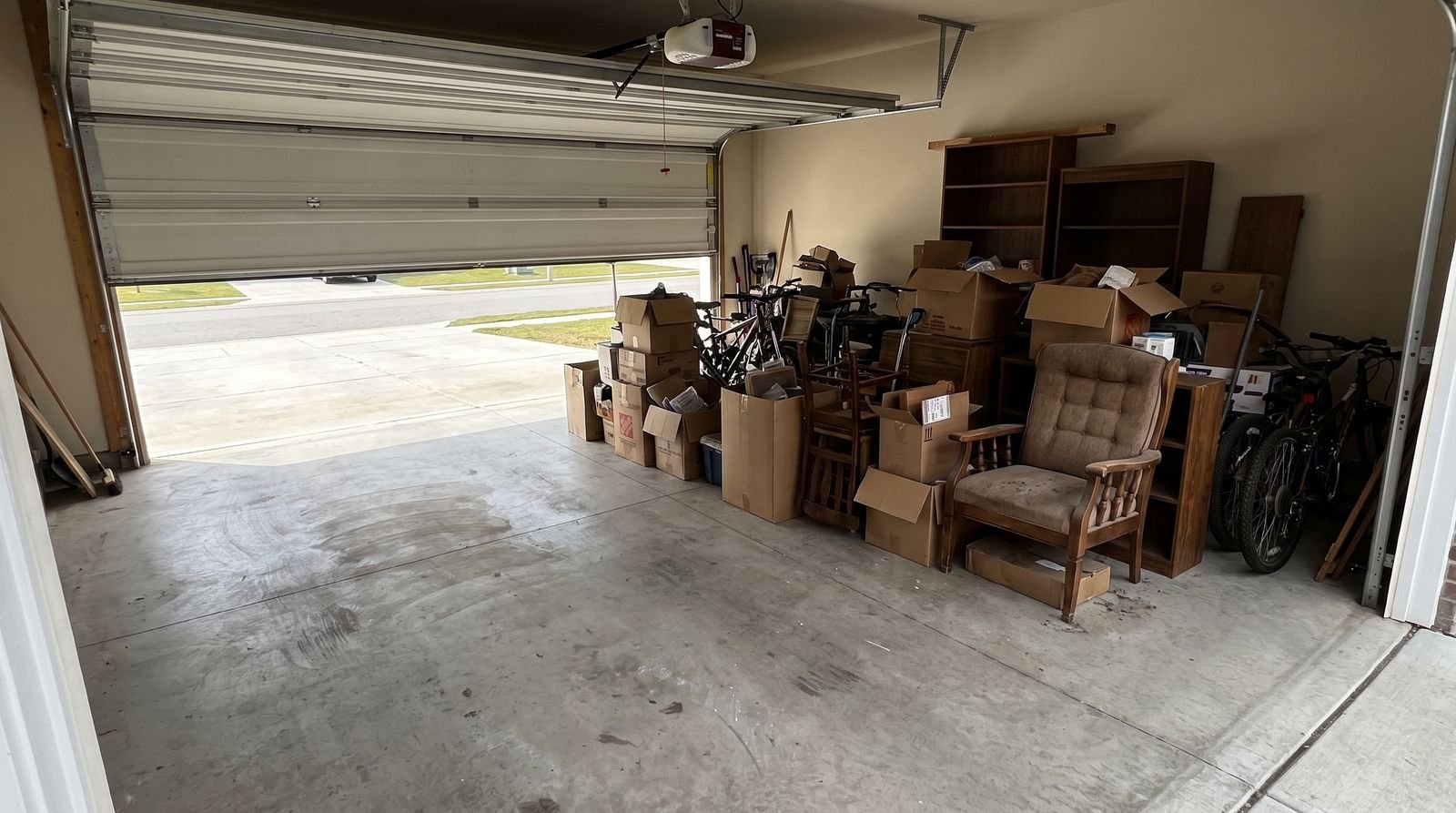 A two car garage part way through a cleanout